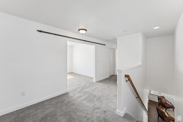 13316 S Moseley Way, Herriman, UT 84096 - carpeted empty room featuring baseboards and a barn door