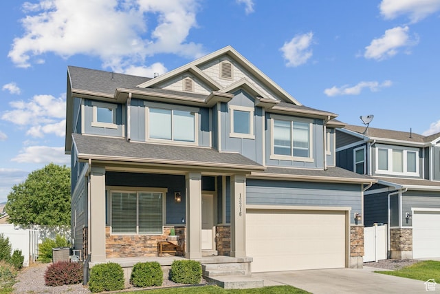 13316 S Moseley Way, Herriman, UT 84096 - view of front facade featuring a garage, stone siding, board and batten siding, covered porch, and concrete driveway