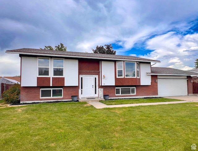2072 W 5075 S, Roy, UT 84067 - bi-level home featuring a garage, a front yard, and brick siding