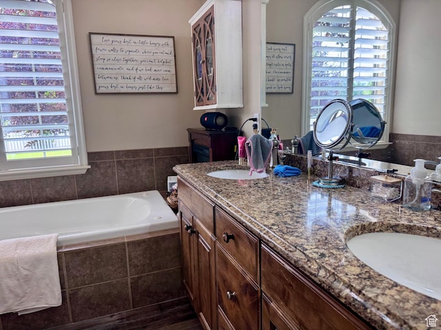 23 S 2200 W, Roosevelt, UT 84066 - bathroom with healthy amount of natural light, double vanity, and a bath