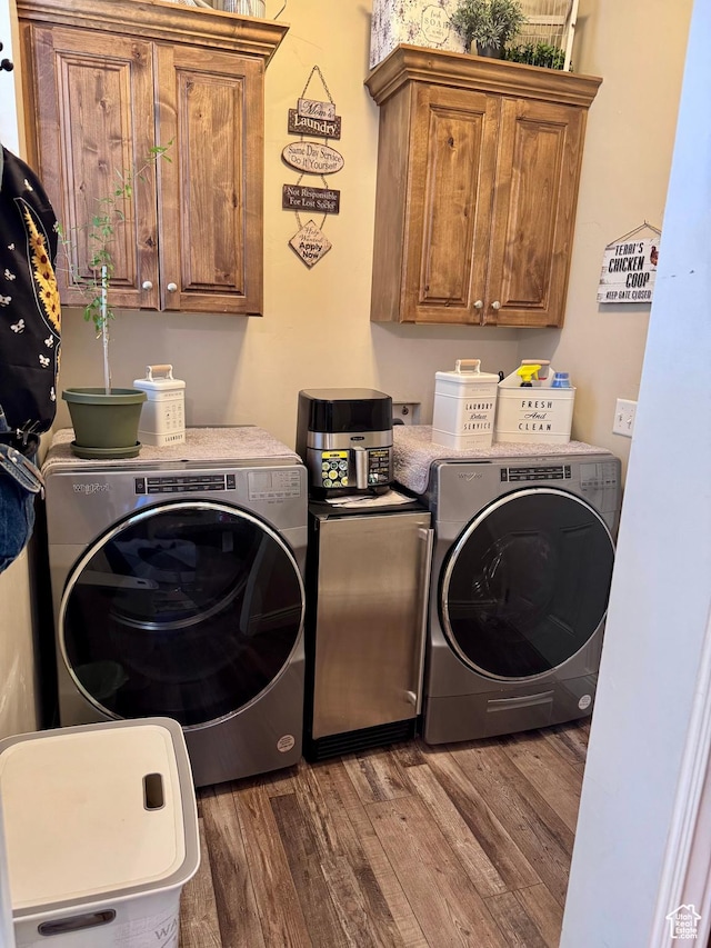 23 S 2200 W, Roosevelt, UT 84066 - laundry room featuring cabinet space, washer and clothes dryer, and wood finished floors
