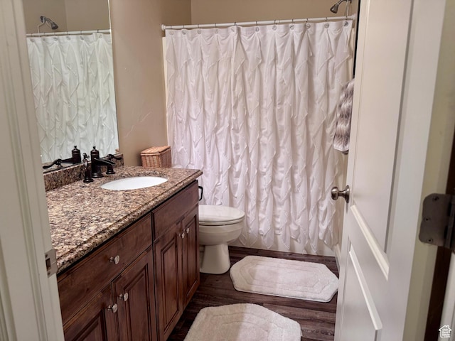 23 S 2200 W, Roosevelt, UT 84066 - full bathroom with vanity, wood finished floors, and a shower with curtain