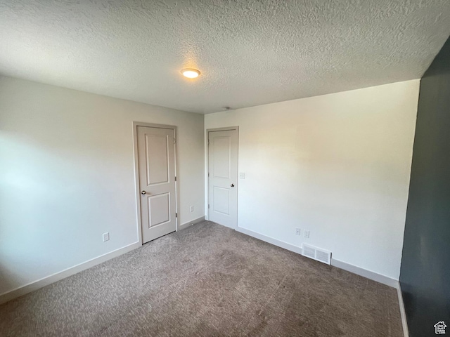 11766 S Watercourse Rd, South Jordan, UT 84009 - carpeted empty room with baseboards and a textured ceiling