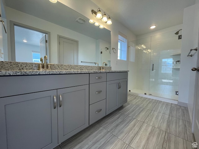 11766 S Watercourse Rd, South Jordan, UT 84009 - bathroom featuring double vanity, a shower stall, and tile patterned floors