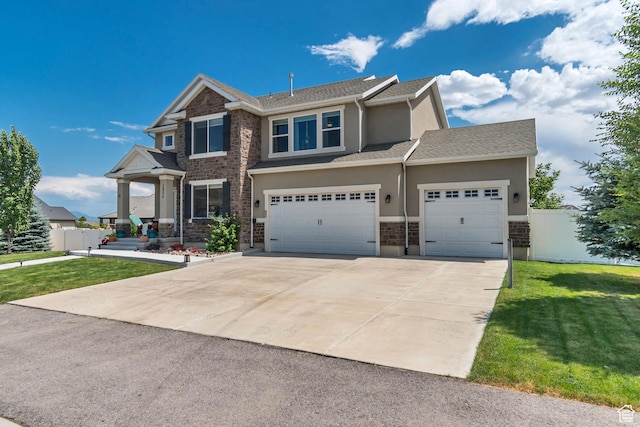 1934 E Sunnyvale Dr, Eagle Mountain, UT 84005 - view of front of home featuring driveway, stucco siding, and a garage