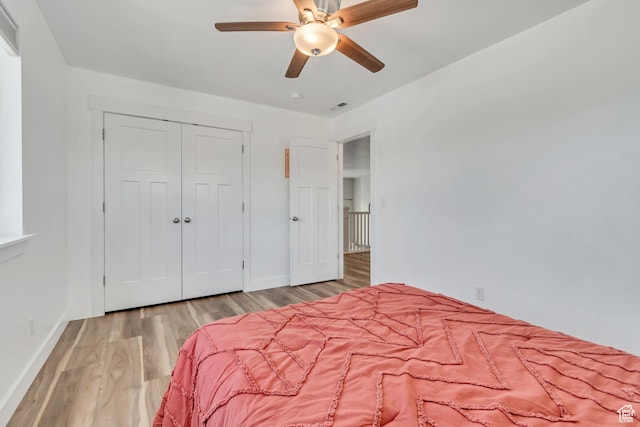 1934 E Sunnyvale Dr, Eagle Mountain, UT 84005 - bedroom with wood finished floors, a closet, and a ceiling fan