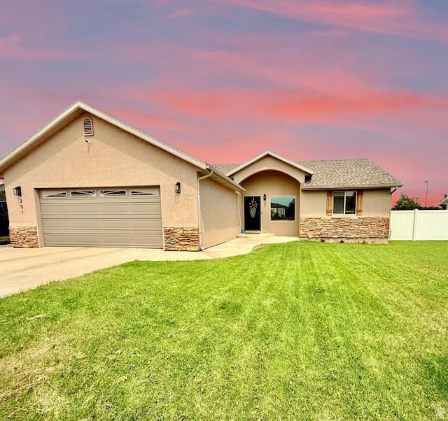 301 S 1350 W, Vernal, UT 84078 - single story home with stone siding, stucco siding, a garage, and driveway