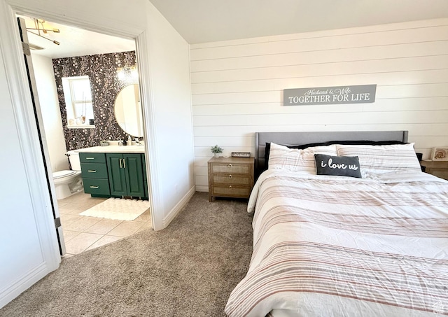 301 S 1350 W, Vernal, UT 84078 - bedroom with light colored carpet, ensuite bath, and light tile patterned flooring