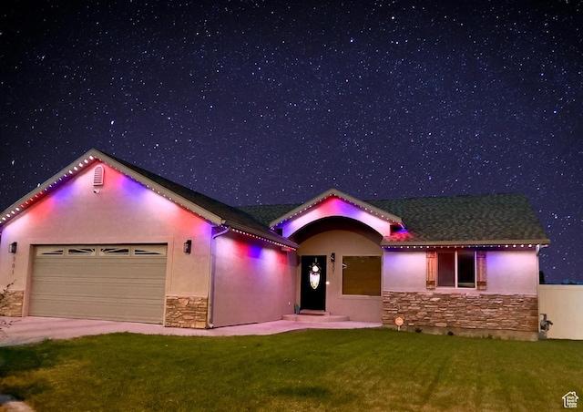 301 S 1350 W, Vernal, UT 84078 - view of front of property with stone siding, a garage, stucco siding, and a lawn