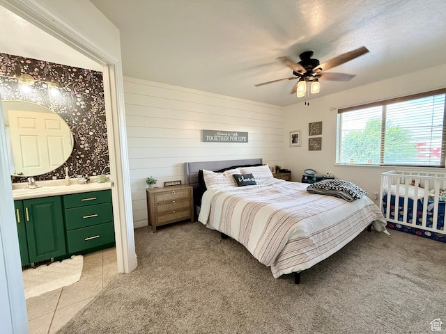 301 S 1350 W, Vernal, UT 84078 - bedroom featuring light colored carpet, connected bathroom, ceiling fan, and light tile patterned floors