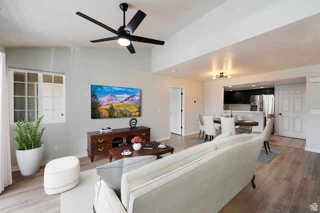 3760 S Carlisle Park Pl W Unit 3, Salt Lake City, UT 84119 - living room with lofted ceiling, light wood-style floors, and ceiling fan
