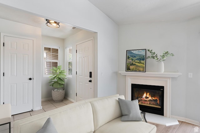 3760 S Carlisle Park Pl W Unit 3, Salt Lake City, UT 84119 - living area with a glass covered fireplace and baseboards