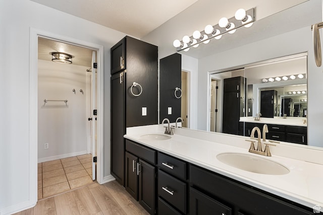 3760 S Carlisle Park Pl W Unit 3, Salt Lake City, UT 84119 - bathroom with double vanity and wood finished floors