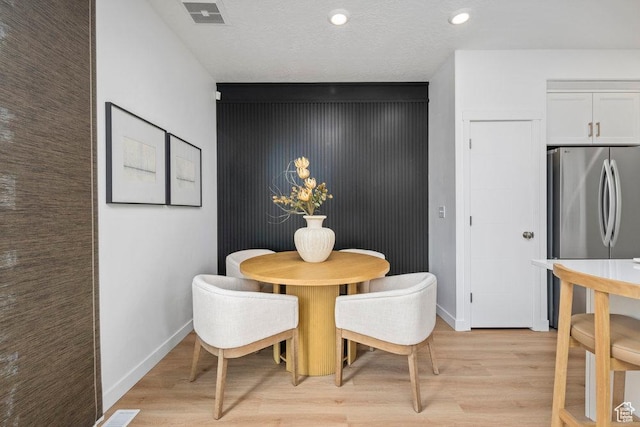 6031 W Highlandbrook Dr, West Jordan, UT 84081 - dining space featuring light wood-type flooring, recessed lighting, and an accent wall