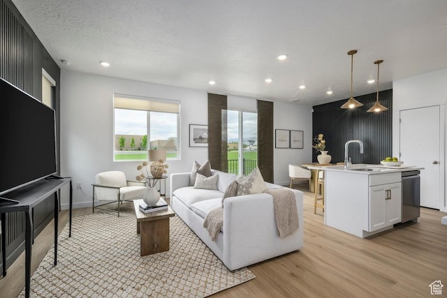 6031 W Highlandbrook Dr, West Jordan, UT 84081 - living room featuring light wood-style floors and recessed lighting