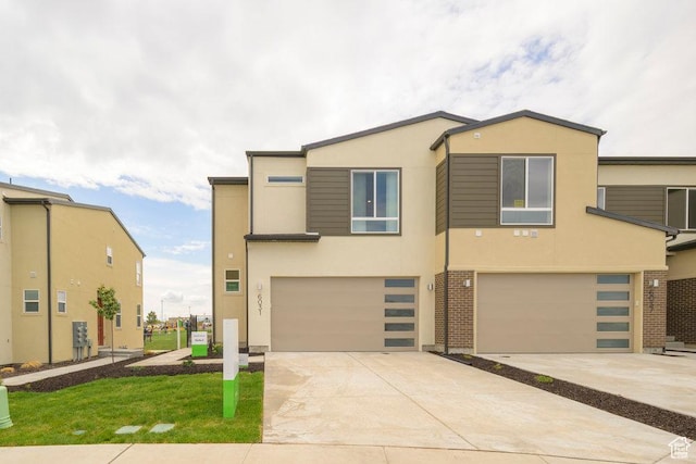 6031 W Highlandbrook Dr, West Jordan, UT 84081 - view of front of house featuring an attached garage, stucco siding, and driveway
