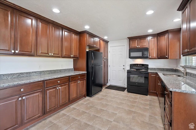 1414 E 275 N, Layton, UT 84040 - kitchen featuring black appliances, light stone countertops, and recessed lighting