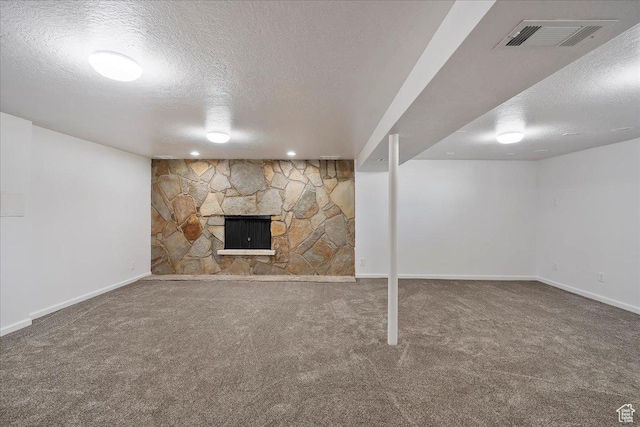 1414 E 275 N, Layton, UT 84040 - finished below grade area with a textured ceiling, carpet flooring, and a stone fireplace