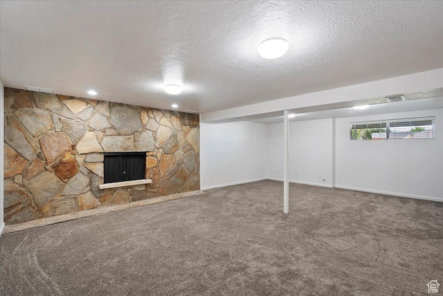 1414 E 275 N, Layton, UT 84040 - below grade area featuring a textured ceiling, carpet flooring, and a fireplace