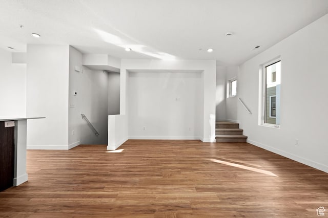 1034 W 1700 S Unit 124, Salt Lake City, UT 84104 - unfurnished living room featuring recessed lighting and wood finished floors
