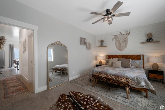 408 S Red Rock Dr W Unit 164, Santaquin, UT 84655 - carpeted bedroom featuring freestanding refrigerator, ceiling fan, arched walkways, and wooden walls