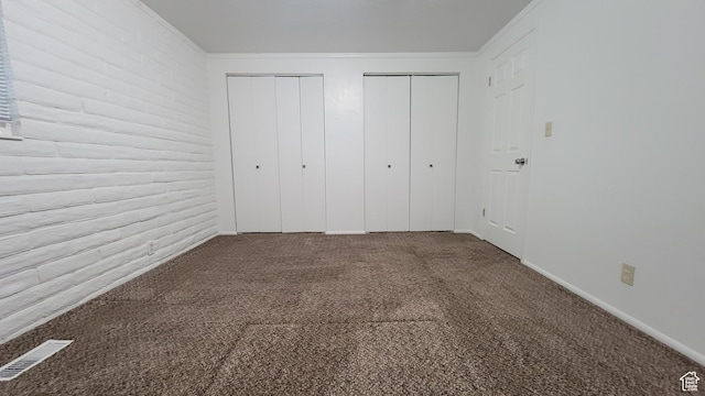 4531 S 700th St E, Murray, UT 84107 - unfurnished bedroom with multiple closets, carpet, and crown molding