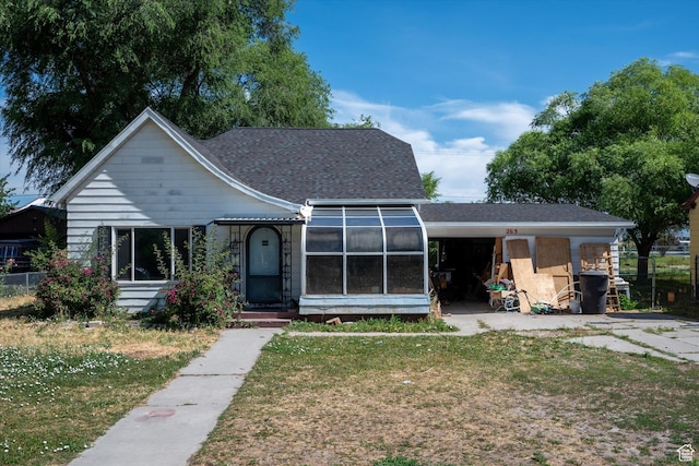 263 E Factory St, Garland, UT 84312 - view of front of property featuring a front lawn and a shingled roof