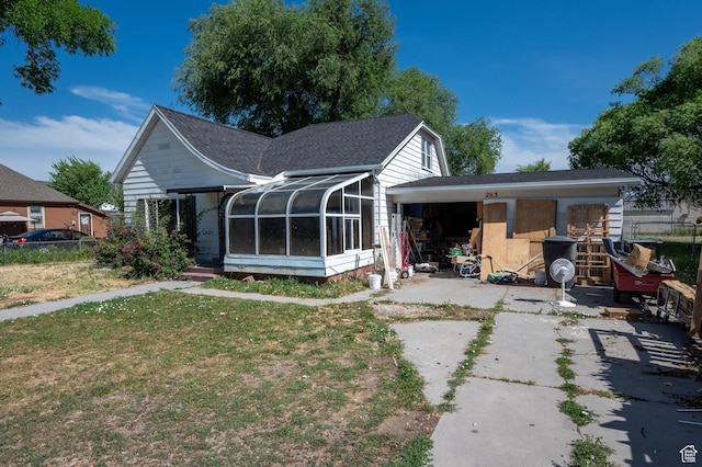 263 E Factory St, Garland, UT 84312 - rear view of property featuring a sunroom