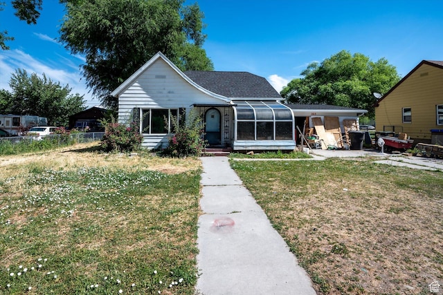 263 E Factory St, Garland, UT 84312 - view of front facade featuring a sunroom