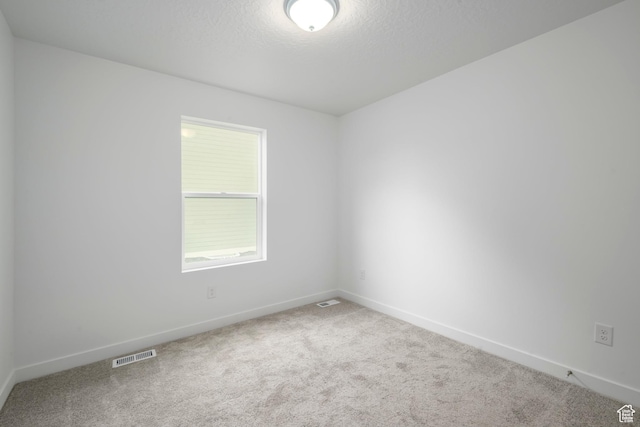 1857 E Bison Dr Unit B217, Eagle Mountain, UT 84005 - empty room with carpet floors and a textured ceiling