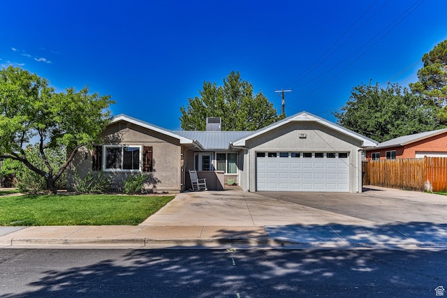 709 N 2200 E, St George, UT 84790 - single story home featuring an attached garage, stucco siding, concrete driveway, and a metal roof