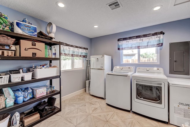 709 N 2200 E, St George, UT 84790 - laundry room featuring electric panel, washer and dryer, a textured ceiling, and recessed lighting