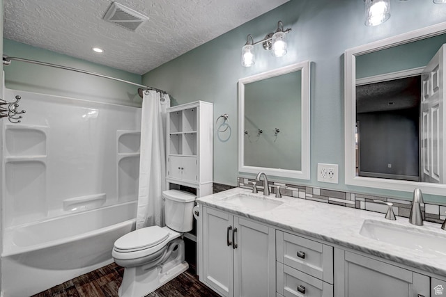 709 N 2200 E, St George, UT 84790 - bathroom featuring a textured ceiling, wood finished floors, double vanity, and shower / bath combo