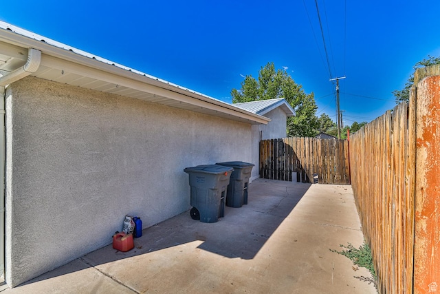 709 N 2200 E, St George, UT 84790 - view of side of property with stucco siding, a patio, and a metal roof