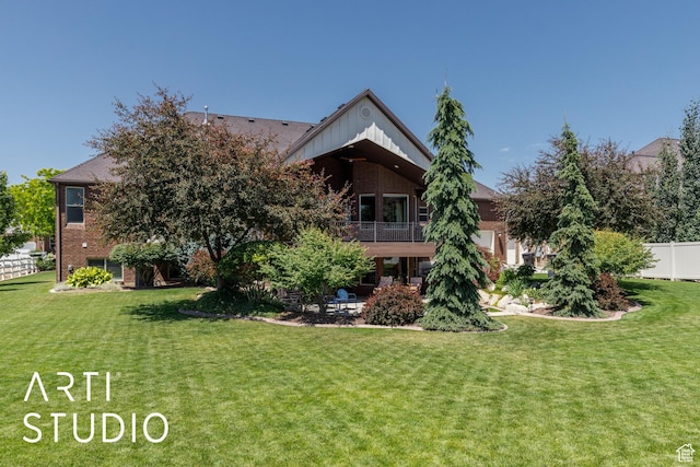 2124 N Heritage Dr, Farr West, UT 84404 - back of house featuring a balcony, brick siding, and a patio