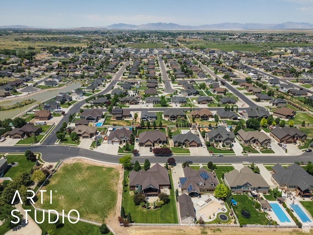 2124 N Heritage Dr, Farr West, UT 84404 - aerial overview of property's location featuring nearby suburban area and mountains