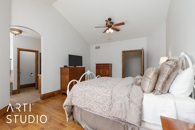 2124 N Heritage Dr, Farr West, UT 84404 - bedroom with vaulted ceiling, light wood finished floors, arched walkways, and a ceiling fan