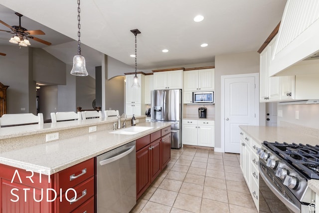 2124 N Heritage Dr, Farr West, UT 84404 - kitchen with appliances with stainless steel finishes, ceiling fan, light tile patterned flooring, an island with sink, and premium range hood