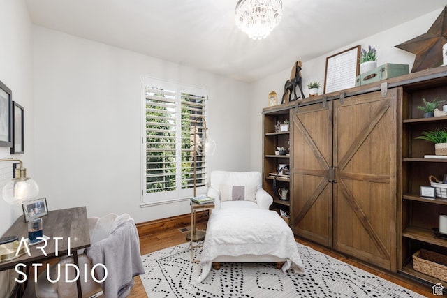 2124 N Heritage Dr, Farr West, UT 84404 - bedroom featuring wood finished floors and a chandelier