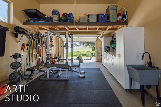 2124 N Heritage Dr, Farr West, UT 84404 - exercise area featuring a sink and a garage