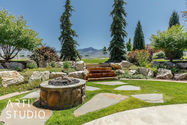 2124 N Heritage Dr, Farr West, UT 84404 - view of yard featuring an outdoor fire pit and a mountain view