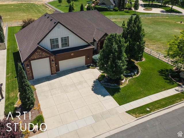 2124 N Heritage Dr, Farr West, UT 84404 - view of front of property featuring a garage, driveway, brick siding, and a shingled roof