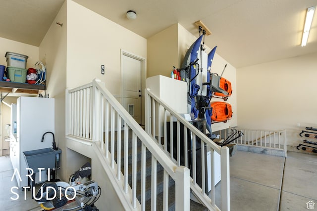 2124 N Heritage Dr, Farr West, UT 84404 - staircase featuring concrete floors
