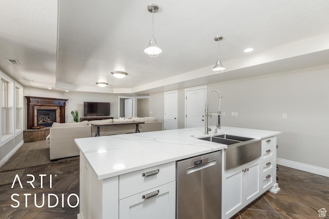 2124 N Heritage Dr, Farr West, UT 84404 - kitchen featuring dishwasher, white cabinets, open floor plan, hanging light fixtures, and a center island with sink