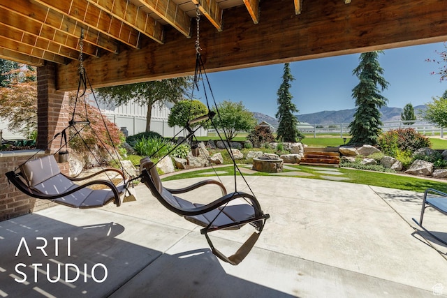 2124 N Heritage Dr, Farr West, UT 84404 - view of patio featuring an outdoor fire pit and a mountain view