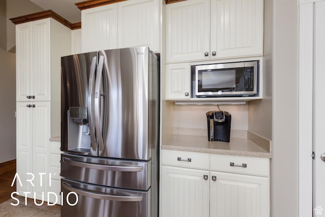 2124 N Heritage Dr, Farr West, UT 84404 - kitchen featuring stainless steel appliances, white cabinets, and light stone counters