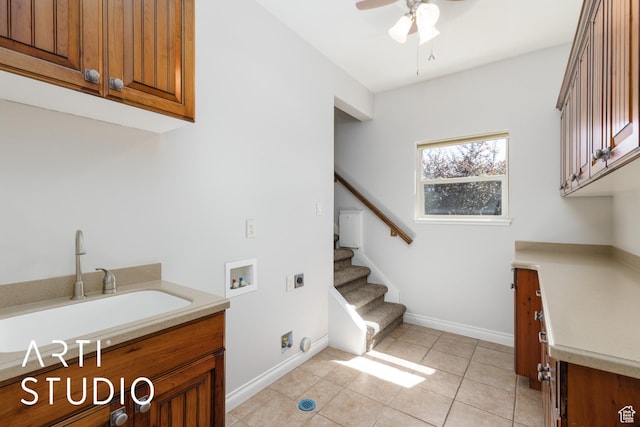 2124 N Heritage Dr, Farr West, UT 84404 - laundry room with hookup for an electric dryer, cabinet space, hookup for a washing machine, ceiling fan, and light tile patterned floors