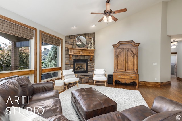 2124 N Heritage Dr, Farr West, UT 84404 - living area with vaulted ceiling, plenty of natural light, a ceiling fan, wood-type flooring, and a fireplace