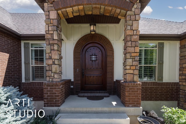 2124 N Heritage Dr, Farr West, UT 84404 - view of exterior entry featuring roof with shingles, brick siding, and stone siding