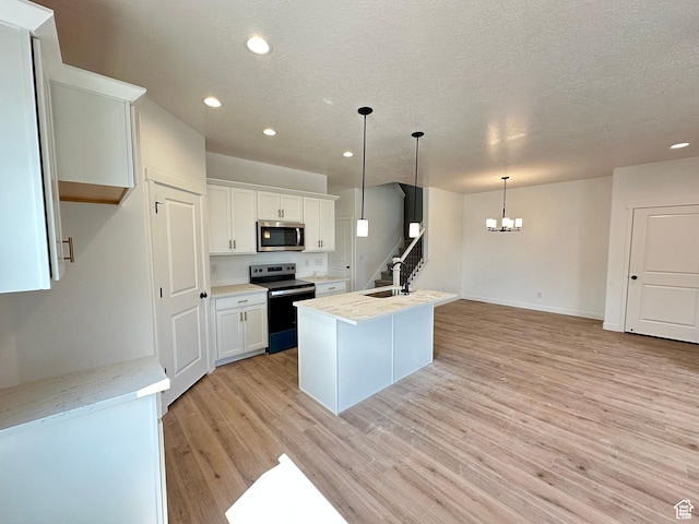 306 E 1480 N Unit 44, Salem, UT 84653 - kitchen featuring stainless steel appliances, recessed lighting, a chandelier, light wood-style floors, and white cabinets